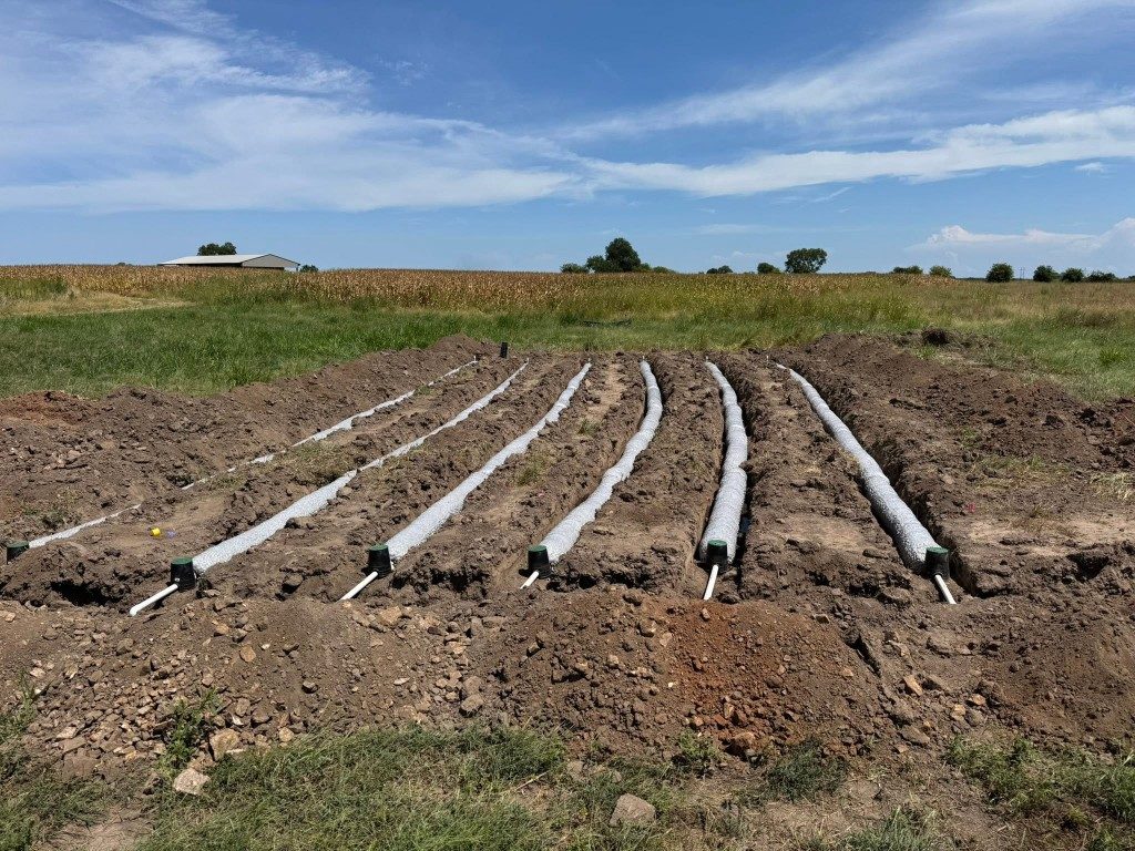 Service line set in a trench through the woods