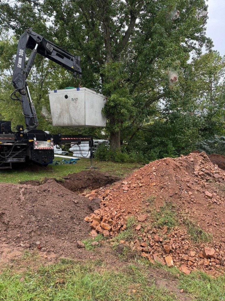 Excavator working through rocky Ozarks ground