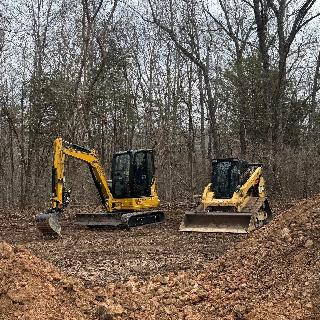 McGlothlin Services excavator and skid steer on a cleared Southwest Missouri job site